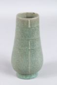 A CHINESE CRACKLE GLAZED PORCELAIN VASE. 18cms high.