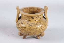 A POTTERY MARBLEISED TWO-HANDLED CENSER. 3ins diameter.