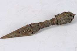A TIBETAN BRONZE PHURBA. 7ins long.