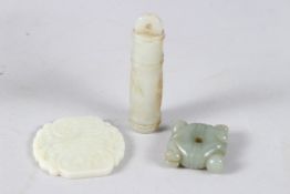 A COLLECTION OF THREE 19TH CENTURY FINELY CARVED CHINESE JADE ITEMS.