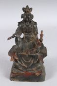 A GOOD CHINESE BRONZE SEATED DEITY. 9ins high.