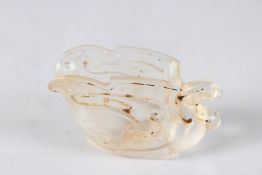 A CHINESE GLASS LIBATION CUP.