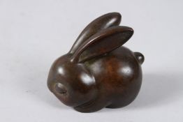 A JAPANESE OKIMONO BRONZE RABBIT.