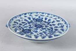 A 19TH CENTURY CHINESE BLUE AND WHITE CIRCULAR WARMING DISH. 10ins diameter.