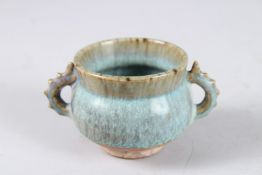 A CHINESE JUN TYPE TWIN HANDLED CENSER. 11cms diameter from handle to handle.