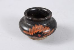 A CHINESE BLACK GLAZED STONEWARE BRUSH WASHER. 8cms diameter.