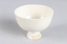 A TANG STYLE WHITE STEM CUP. 3.5ins diameter.