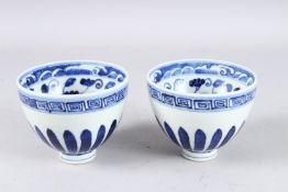 A PAIR OF CHINESE BLUE AND WHITE BOWLS in Ming style, bears four-character mark. 12.1cms diameter.