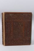 A FINELY CARVED 19TH CENTURY MAYSORE SANDALWOOD BOOK COVER. 10ins x 8ins.