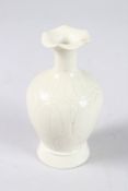 A CHINESE DING TYPE LONG NECK VASE. 12cms high.