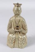A CHINESE CELADON WINE POT of a lady. 20cms high.