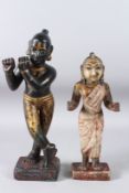 A LARGE AND FINELY CARVED EARLY 19TH CENTURY INDIAN PAINTED AND GILDED STONE FIGURES OF KRISHNA