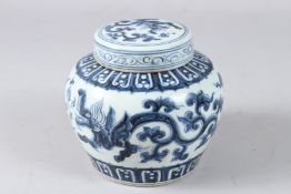 A CHINESE BLUE AND WHITE GINGER JAR AND COVER.