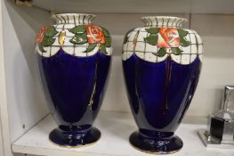 A pair of Barnsley ware vases by Frederick Rhead in the rose and trellis pattern.