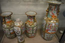A large Chinese Canton famille rose baluster shaped vase together with a pair of similar vases and a
