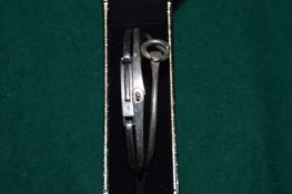 Three decorative silver bangles.