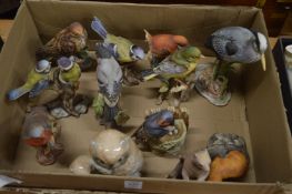A group of porcelain birds and animals.