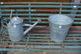 Galvanised watering can and bucket.