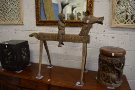 An unusual carved wood model of a horse and rider, possibly Benin or similar.