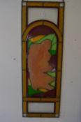 An unusual pair of leaded stained glass panels each depicting an Art Nouveau style moulded female