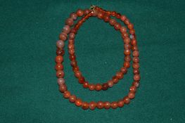 A hard stone necklace.