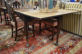A 19th century mahogany rectangular drop-leaf gateleg dining table.