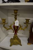 A pair of ormolu twin branch three light candleabra.