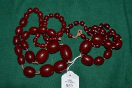 Two cherry amber style bead necklaces.