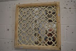 A pair of Moroccan style square shaped mirrors with painted frames and pierced decoration.