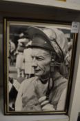 A signed black and white photograph of the jockey Lester Piggott.
