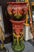 A Majolica jardinere on matching stand.