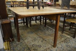 A 19th century mahogany drop-leaf gateleg dining table.