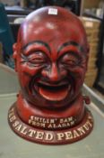 A novelty cast iron Salted Peanut man dispenser.
