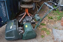 An Atco Balmoral 17SE petrol cylinder lawn mower with key start.