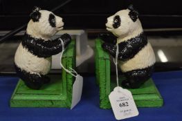 A pair of cast iron panda bookends.