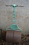 A cast iron garden roller.