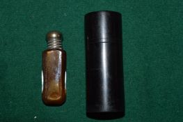 Silver mounted ebony cylindrical box and cover together with a scent bottle.