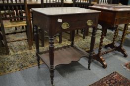 A 19th century mahogany work table with rising top, single drawer on turned legs with an undertier.