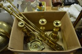 Brass companion set, door knocker and candlesticks.
