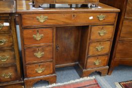 A George III mahogany kneehole desk.