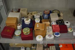 A large quantity of porcelain and other trinket boxes etc, mostly with original packaging.