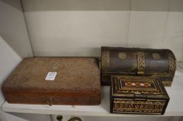 Three decorative boxes.