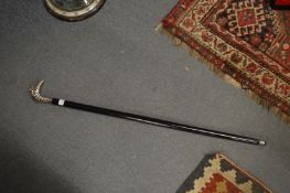 A walking stick with Michelin man handle.