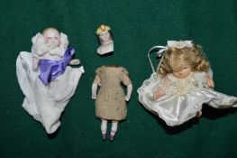 Miniature porcelain dolls.