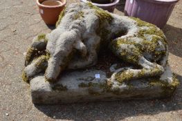 A good weathered composite garden model as a recumbent hound.