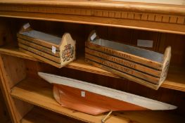 A pair of novelty storage or flower boxes.