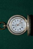 An engine turned silver pocket watch.