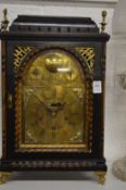 An 18/19th century Continental mantel clock with arched brass dial, signed Sebastian Kurz.