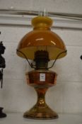 A copper oil lamp.