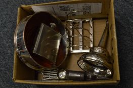 A plated coaster, toast rack, wine funnel etc.